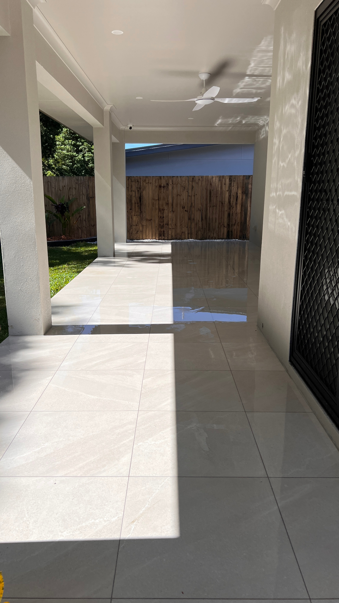 Clean outdoor tiled patio after pressure washing