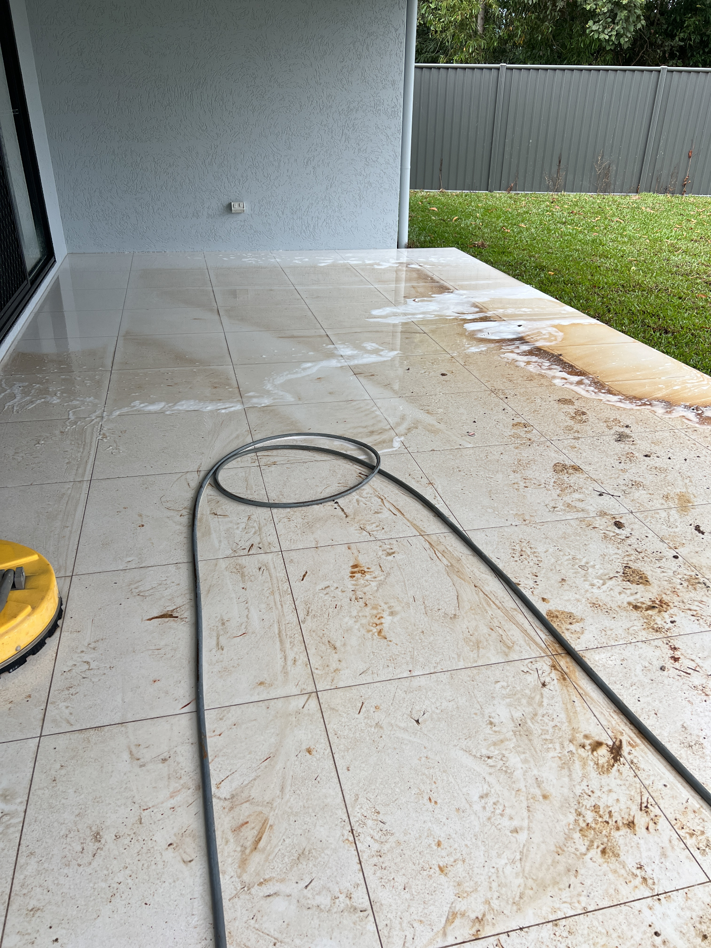 Dirty alfresco tiles before pressure washing